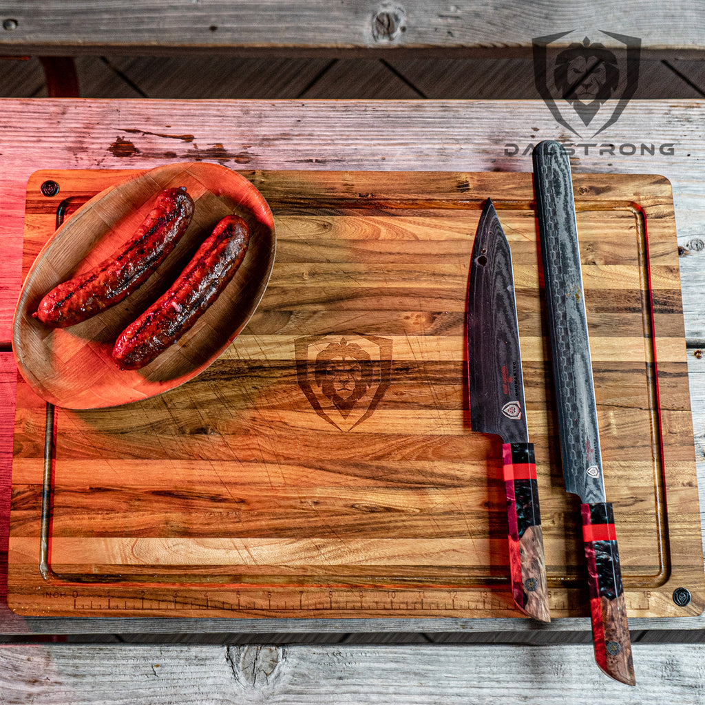 Sausages and two kitchen knives on a cutting board