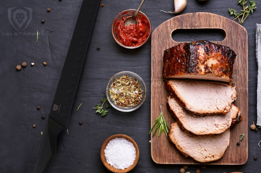 A photo of the Slicing & Carving Knife 12" Shadow Black Series | NSF Certified | proformapeakmarketing  with three slices of ham on top of a wooden table