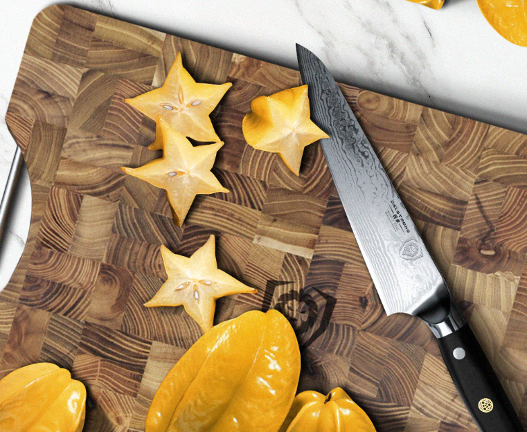 A photo of the Chef's Knife 7" Shogun Series ELITE | proformapeakmarketing with slices of star fruits on top of a proformapeakmarketing wooden board.