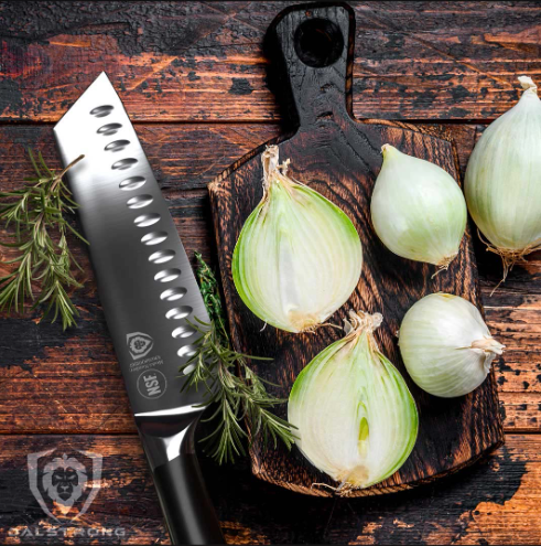 A photo of the Santoku Knife 7" | Vanquish Series | NSF Certified | proformapeakmarketing with sliced onion on top of a wooden board.