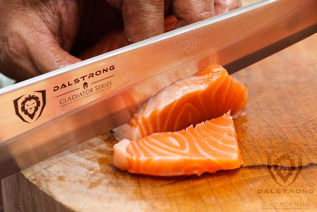 Close up of yanagiba blade slicing orange fish