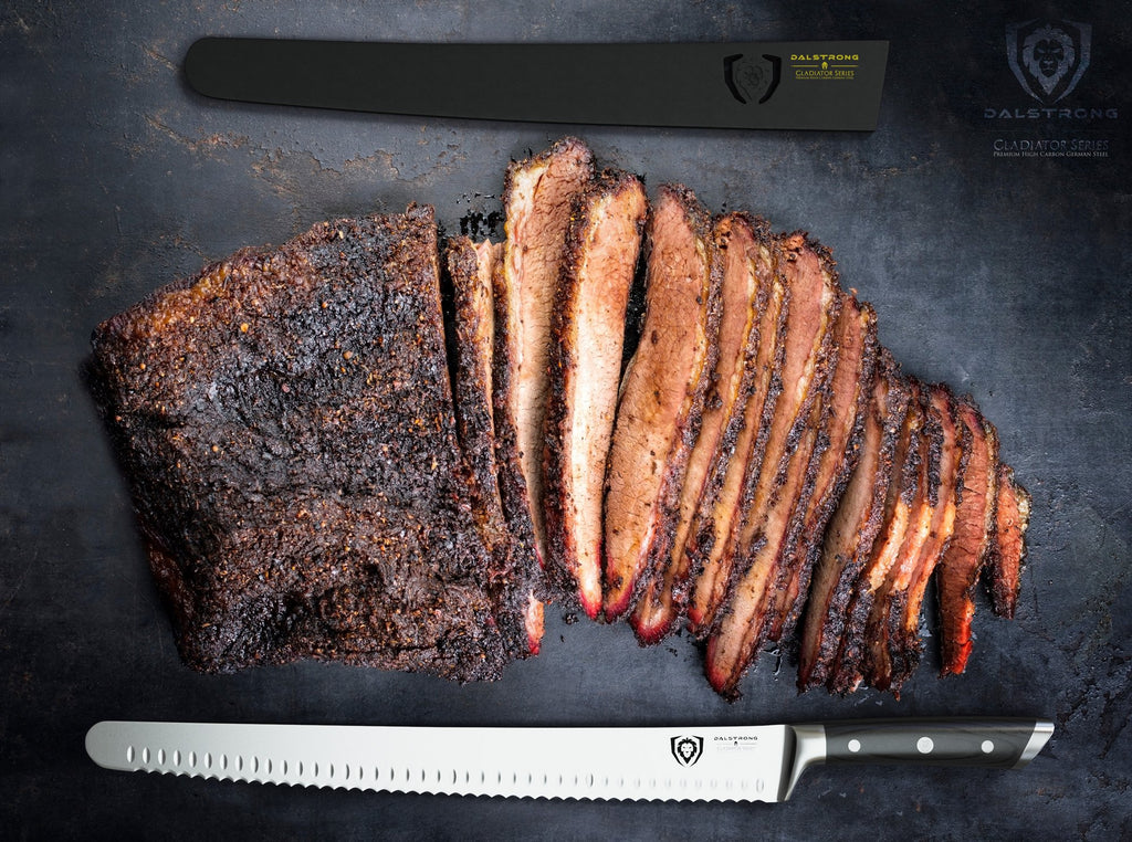 Sliced barbecue brisket on a black surface with a stainless steel slicing knife laying in front