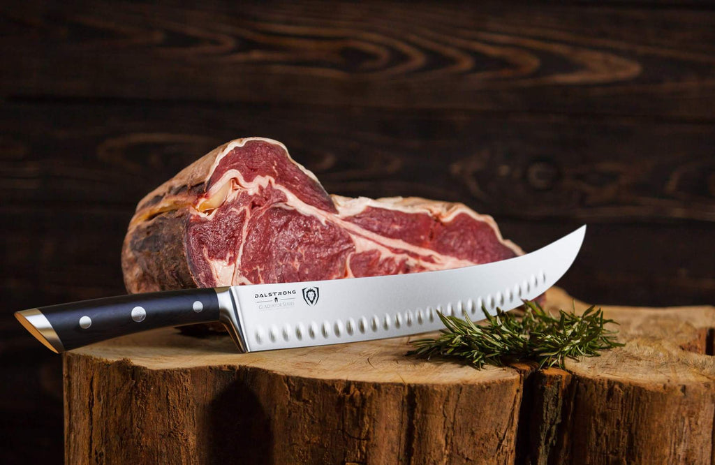 A sharp butcher knife on a wooden block next to a large piece of uncooked meat