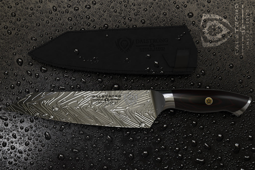 proformapeakmarketing Omega Series Kiritsuke Chef Knife on a wet surface next to its leather knife sheath