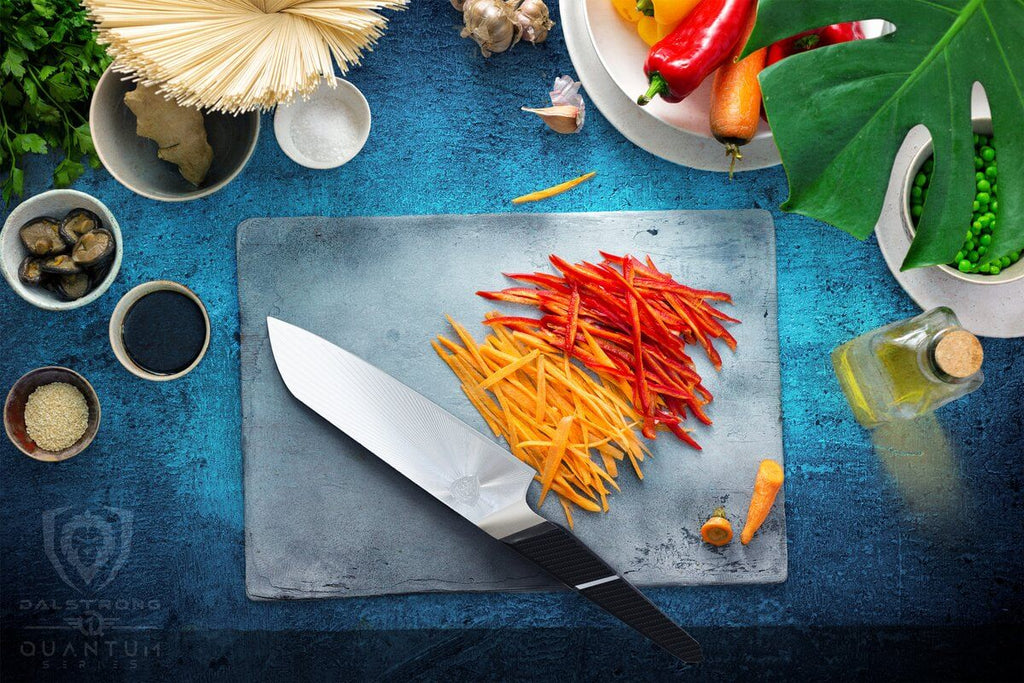 proformapeakmarketing Santoku knife cutting up vegetables on cutting board