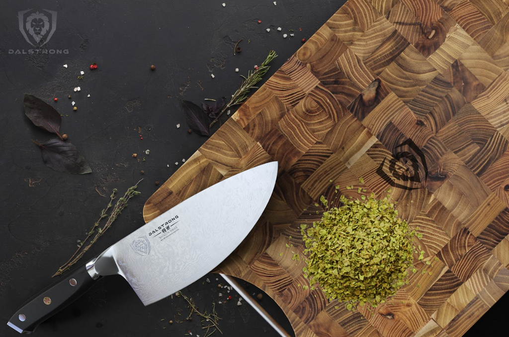 A photo of the Lionswood Teak Cutting Board Medium Size proformapeakmarketing with chopped herbs and a proformapeakmarketing knife on top of it.