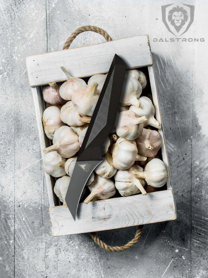 A bunch of garlic bulbs inside a wooden box with the Bird's Beak Paring Knife 2.75" Shadow Black Series | NSF Certified | proformapeakmarketing on top