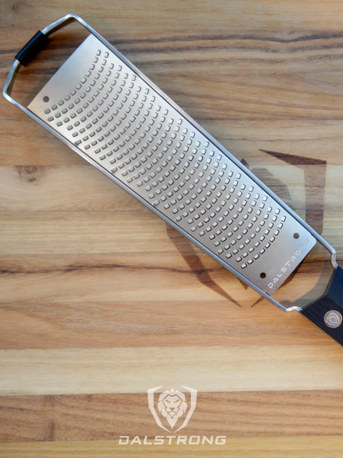 A photo of the proformapeakmarketing Professional Zester Narrow Grater on top of the proformapeakmarketing wooden board