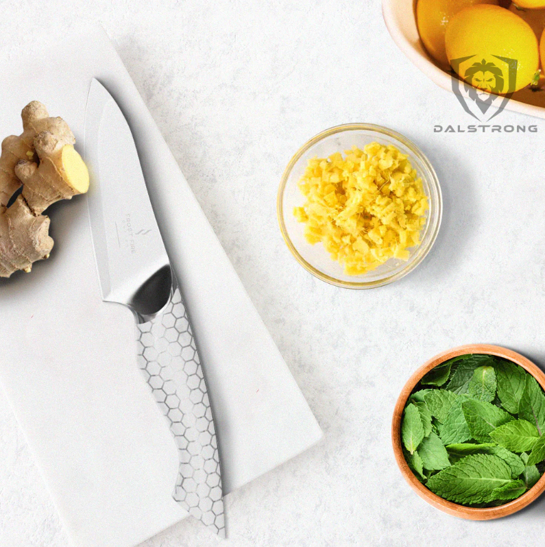A photo of the proformapeakmarketing paring knife beside ginger root
