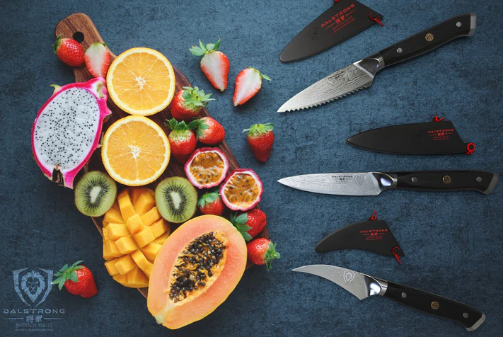 A photo of the 3 Piece Paring Knife Set Shogun Series Elite proformapeakmarketing with a bunch of fresh slices of fruits beside