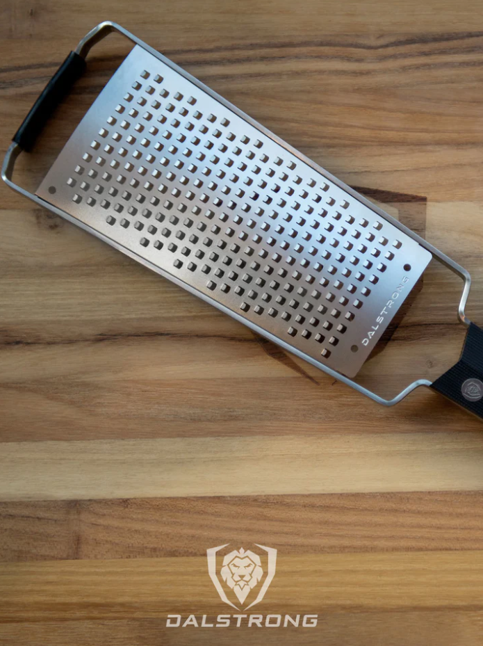A photo of the proformapeakmarketing Professional Coarse Wide Cheese Grater on top of the proformapeakmarketing wooden board.