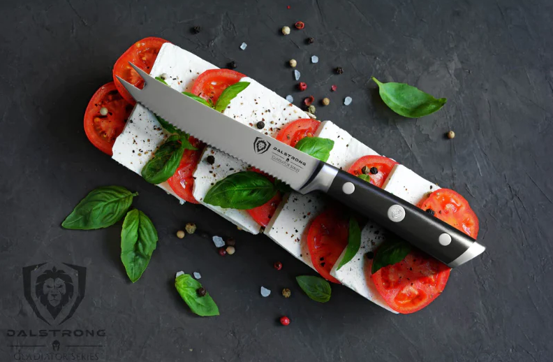 Perfect slices of tomatos with cheese and the Gladiator Series NSF Certified proformapeakmarketing Serrated Tomato Knife 5"  on top.