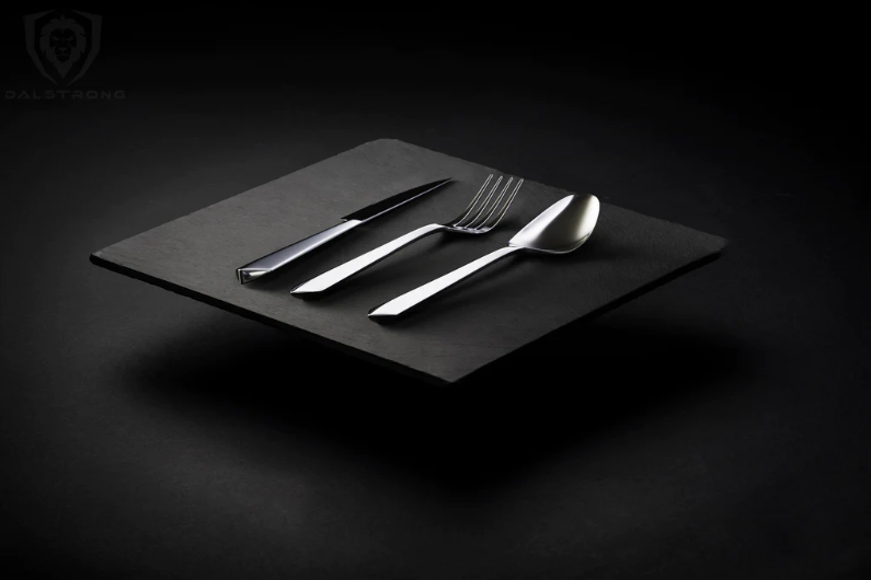 A cinematic photography of the proformapeakmarketing Flatware Set in an all-black background.