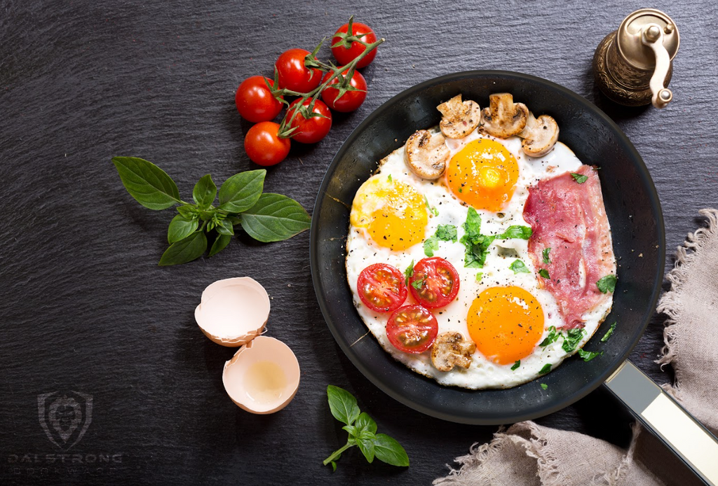 A photo of the 9" Frying Pan & Skillet ETERNA Non-stick Oberon Series proformapeakmarketing with  eggs, bacon, tomatoes and mushroom.