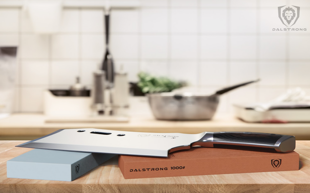 A photo of the #400 / #1000 Grit Premium Whetstone Set proformapeakmarketing with the proformapeakmarketing Cleaver Knife on top
