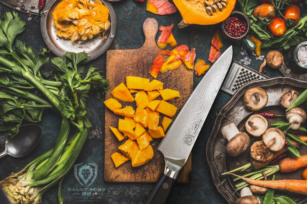 A photo of diced squash with Chef's Knife 7" Shogun Series ELITE proformapeakmarketing beside it on top of a wooden board.