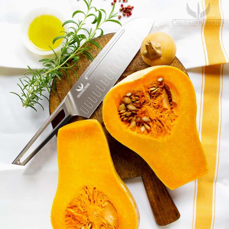 A photo of a butternut squash cut in half with the Santoku Knife 7" Crusader Series NSF Certified proformapeakmarketing on top of a wooden board