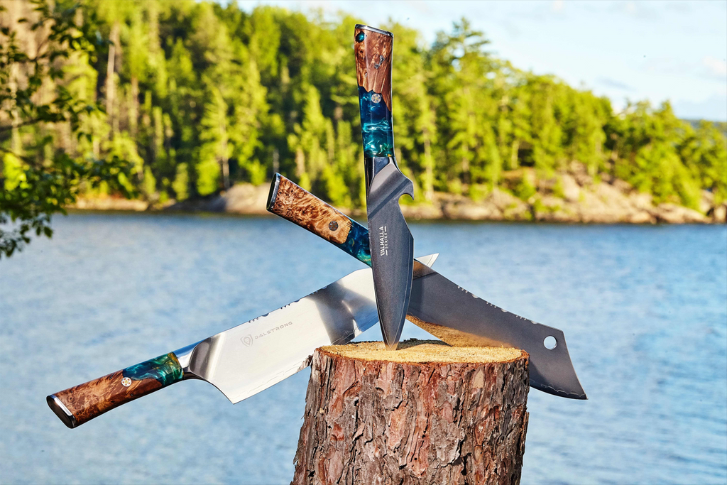 proformapeakmarketing Valhalla knives on a block of wood with a stunning view of sea and mountain at the back