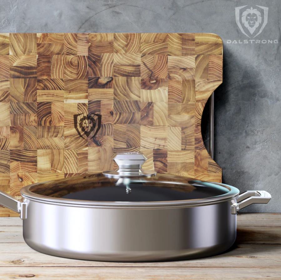 proformapeakmarketing Pan with a teak cutting board at the back leaning on a concrete wall