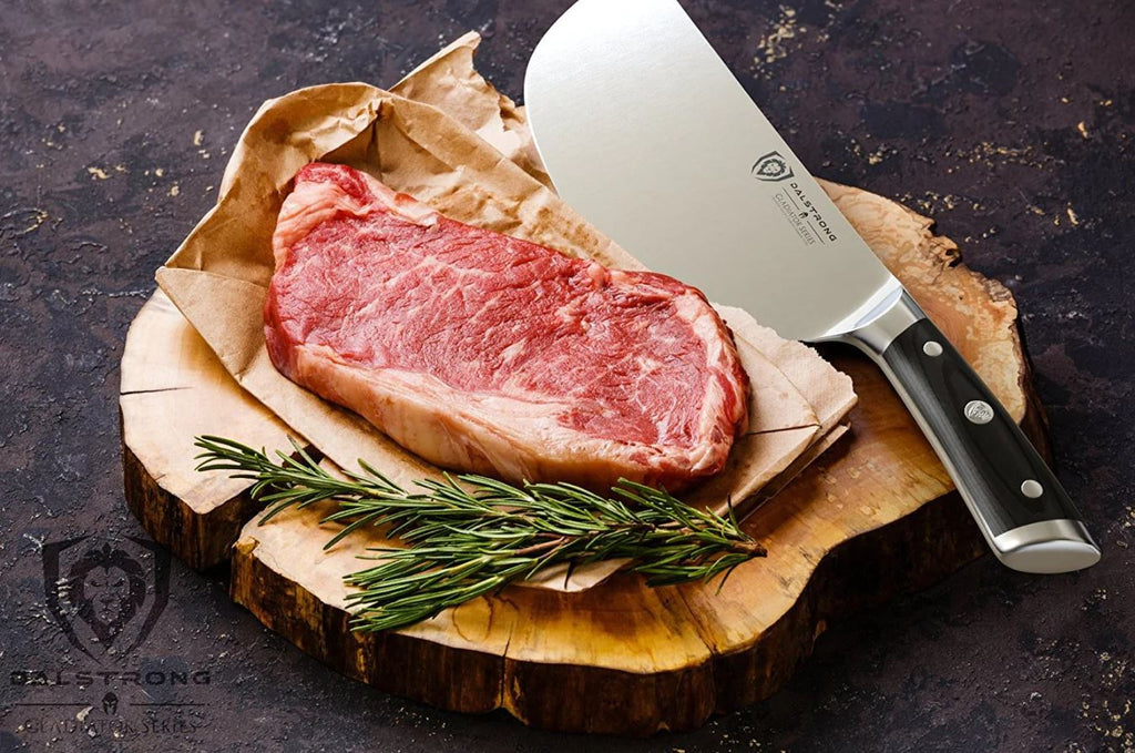proformapeakmarketing meat cleaver beside a slice of meat and rosemary placed on top of a wooden cutting board