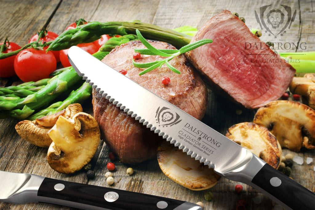 Gladiator Series Steak knife laying against a pile of chopped medium rare steak and grilled vegetables