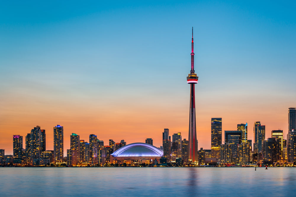 Toronto City Skyline over lake Ontario at night