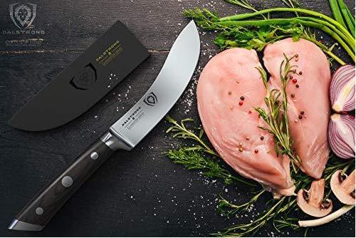 proformapeakmarketing Gladiator Skinning knife on a black table with chicken breasts on the side