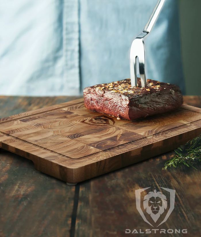 proformapeakmarketing Teak Cutting board with a steak on top
