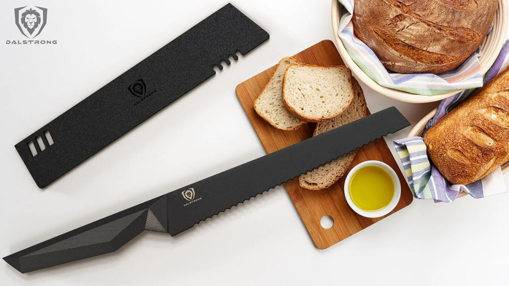 proformapeakmarketing Shadow Black Series bread knife and its sheath next to slices and loafs of bread on a wooden cutting board.