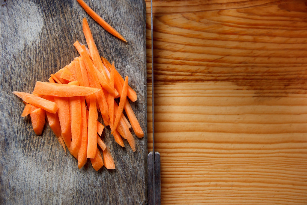 Slices of carrots on a cutting board.