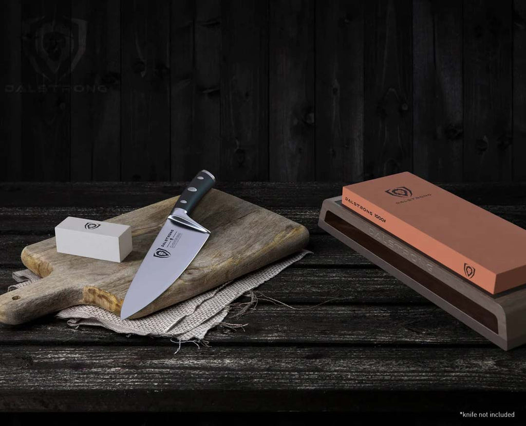 Premium Whetstone Kit #1000 / #6000 Grit with Nagura Stone & Rust Eraser with a cutting board and a knife on a table.
